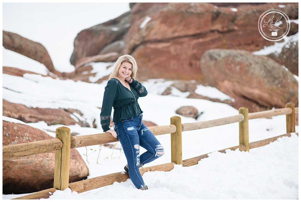 Senior Picture on snowy fence