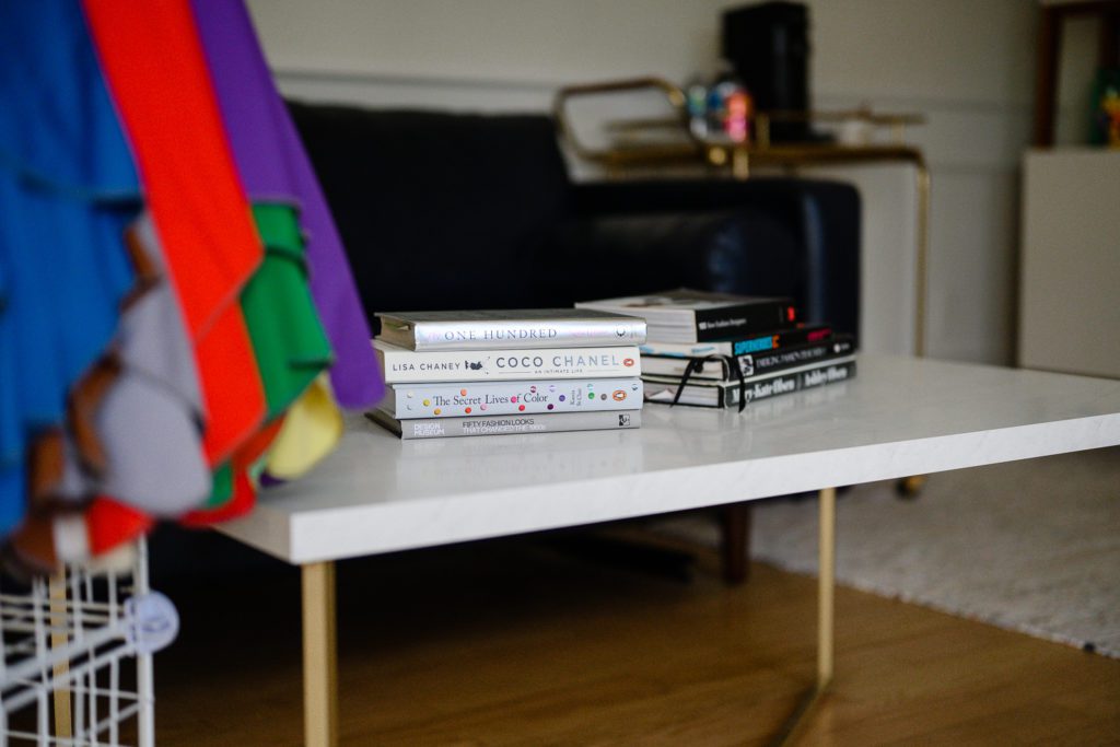 A stack of books about fashion on a coffee table as taken for Denver Branding Photos