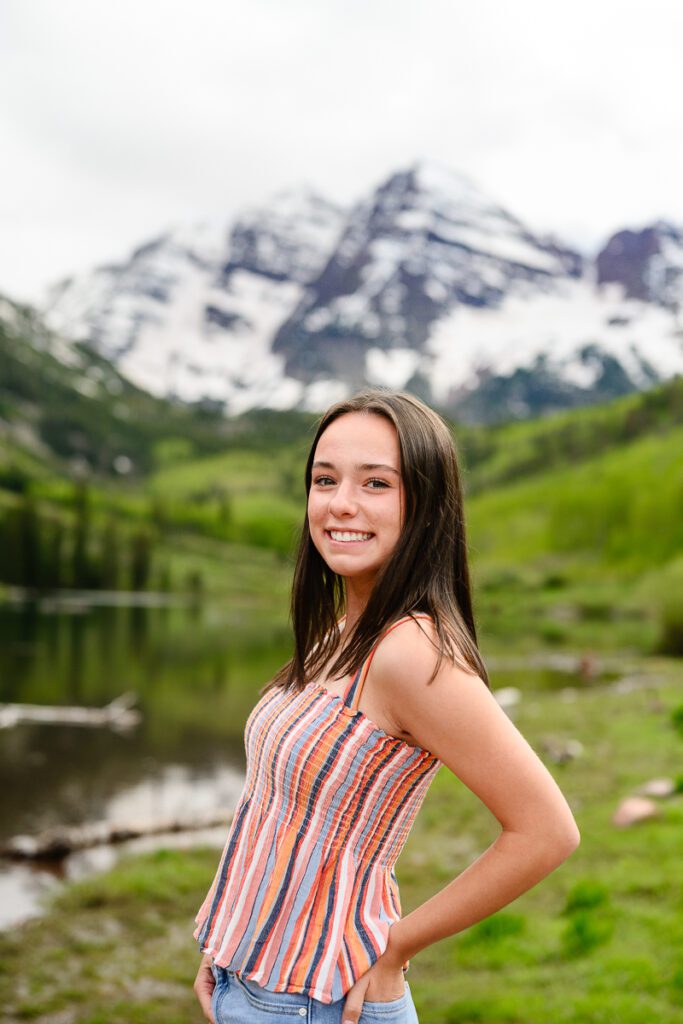 A closeup of a girl standing in front of the Maroon Bells in Aspen Colorado for her Colorado Senior Pictures