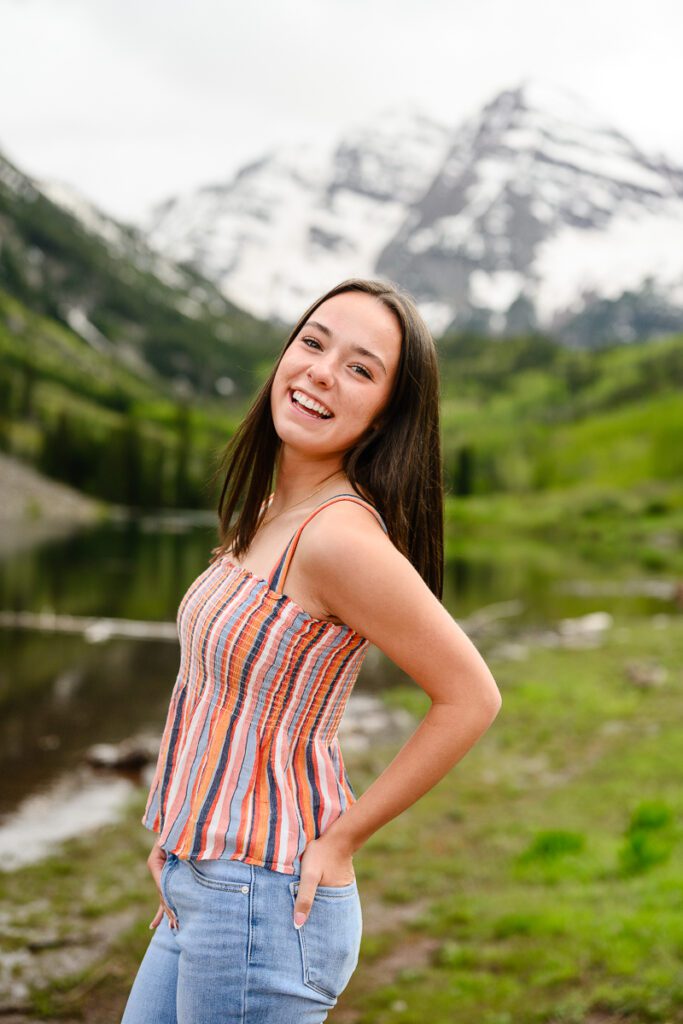 The Maroon Bells in Aspen Colorado is the backdrop for this epic Colorado Mountain senior pictures
