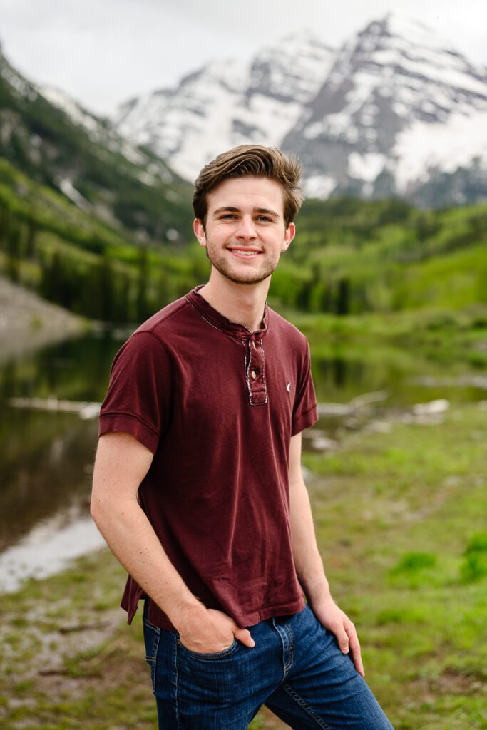 Aspen Colorado Maroon Bells senior picture of a senior guy standing in front of the lake