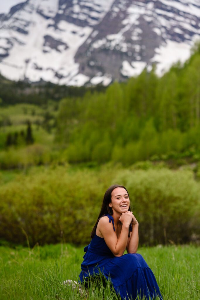 Colorado mountain photographer captures a senior girl in front of the maroon bells in Aspen Colorado