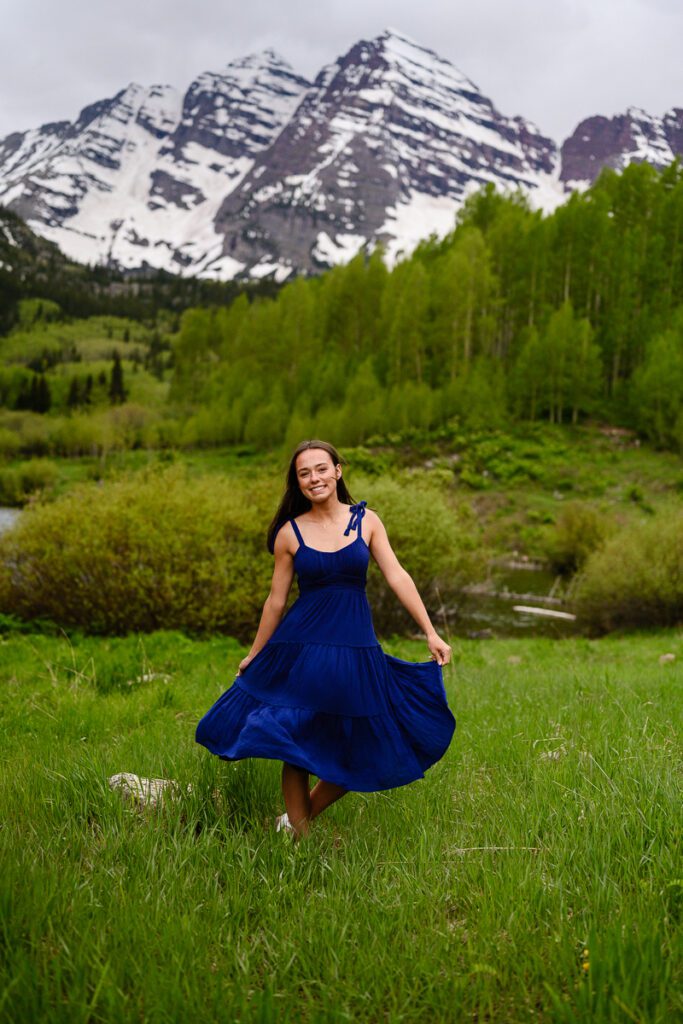 A denver senior photographer captures a senior girl for her senior pictures at Maroon Bells in Aspen Colorado