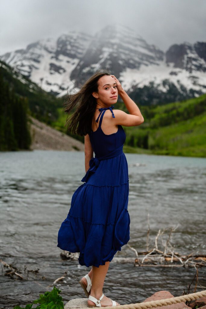 A storm rolls in over the Maroon Bells during this Colorado Mountain senior pictures by a Denver senior photographer