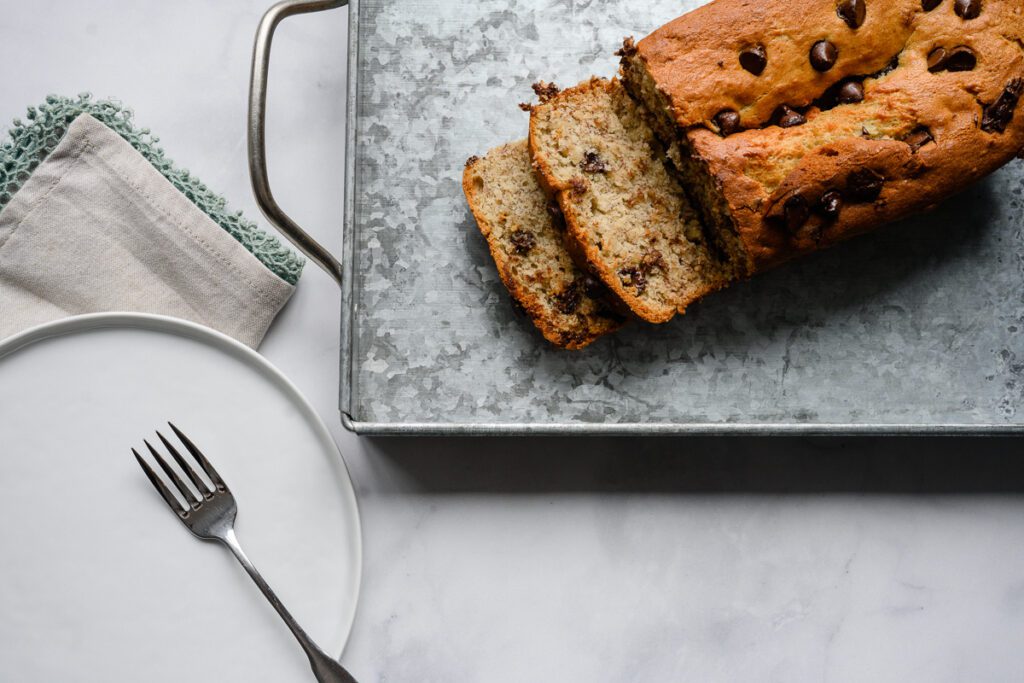 A flatlay of banana bread captured by a Denver Branding photographer for a Denver branding photoshoot for a branding consultant and brand strategist.